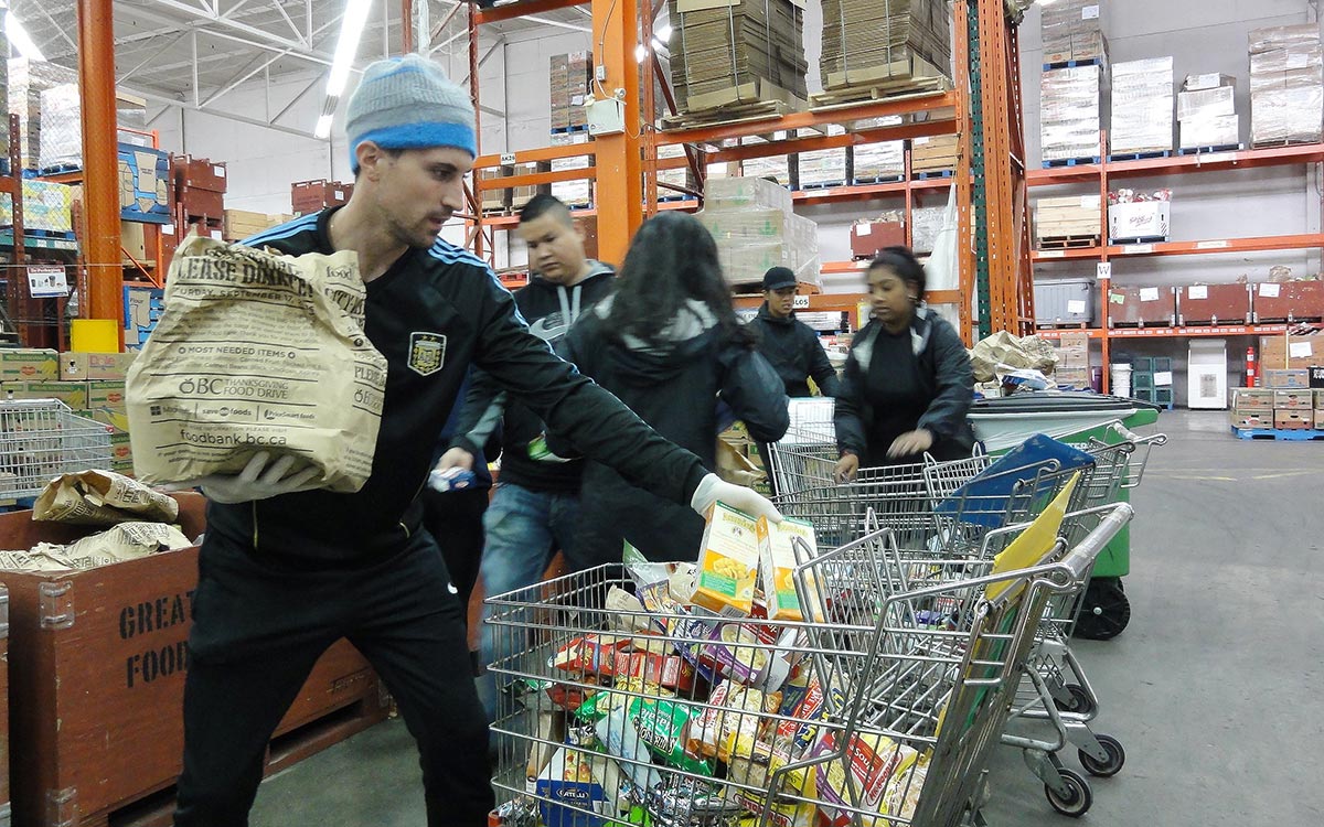 JIBC law enforcement students put in three-hours shifts at a food bank depot.
