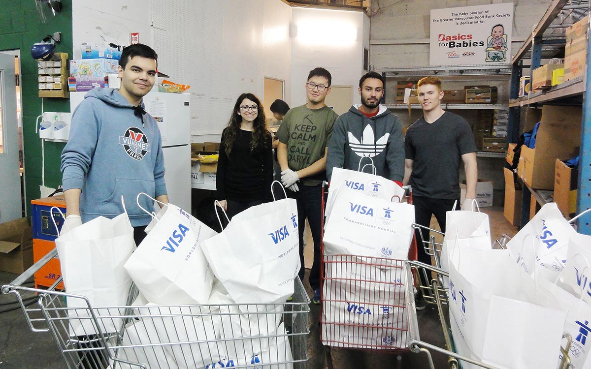 JIBC law enforcement studies students put in three-hour shifts at a food bank depot.