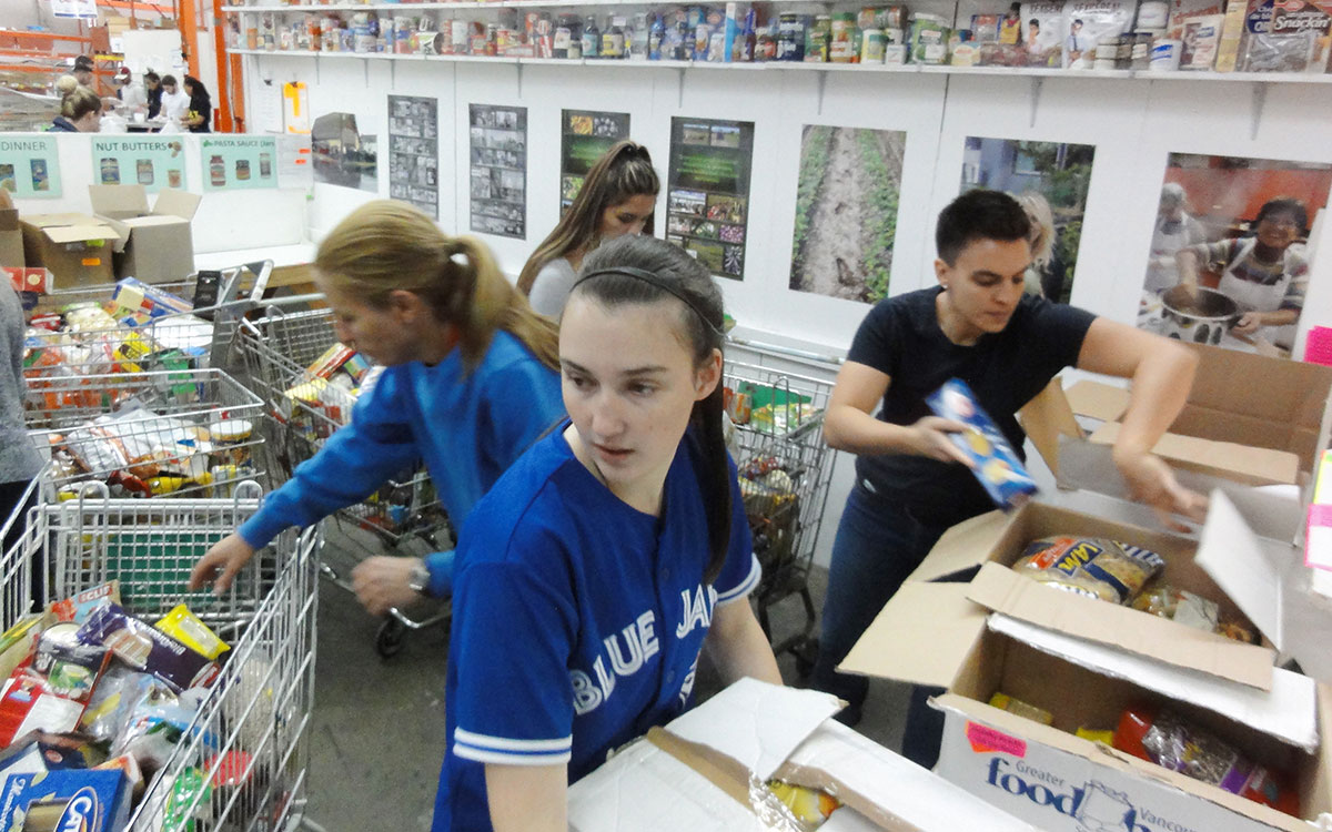 JIBC law enforcement students put in three-hours shifts at a food bank depot.