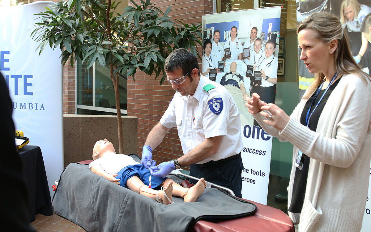 Advanced Care Paramedic student David Stanton and instructor Jodi Butterman demonstrate the use of new training equipment during a vist by representatives of the donors, the BC/Yukon Command of the Royal Canadian Legion Foundation.