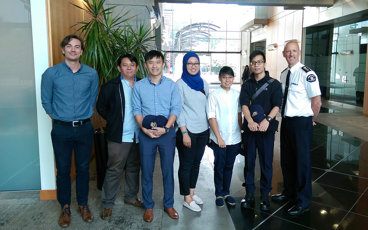 SUSS students and JIBC's Leon Baranowski, with Joe Acker, director of patient care delivery for BC Emergency Health Services (BCEHS) following a field experience visit to the BCEHS offices.