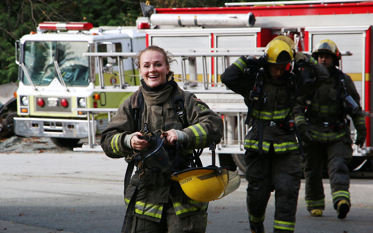 FFTC grad Lindsay Anderson takes a breather after demonstrating a response to a car fire at JIBC's Maple Ridge campus.