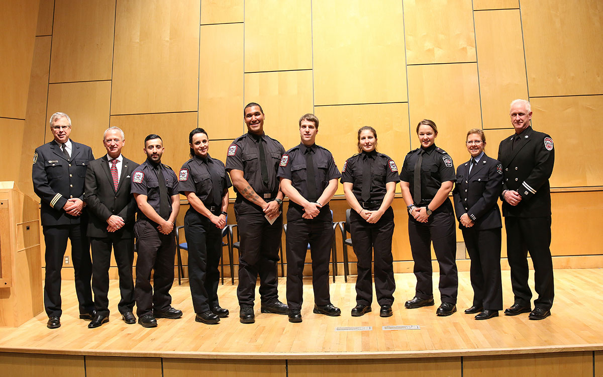 From left: Norm MacLeod, Assistant Fire Chief, Mission Fire Rescue Service; Jeffrey Moore, Honorary Consul of El Salvador; JIBC fire graduates Yousif Safar, Jennifer Simmons, Phoenix Gordon, Ryan Tostenson and Ava Gartner; Alex Moore, Humber College Fire Academy grad; Kim Saulnier, City of Coquitlam fire inspector and JIBC lead instructor; and Capt. Derek Dickson, North Vancouver City Fire Department, at the presentation by 2017 One World students at JIBC’s New Westminster campus. 