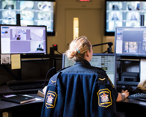 Corrections Officer looking at screens