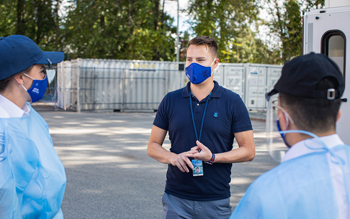 Eric McConaghy, Lead Instructor for JIBC's Primary Care Paramedic program, debriefs with students after training simulations.