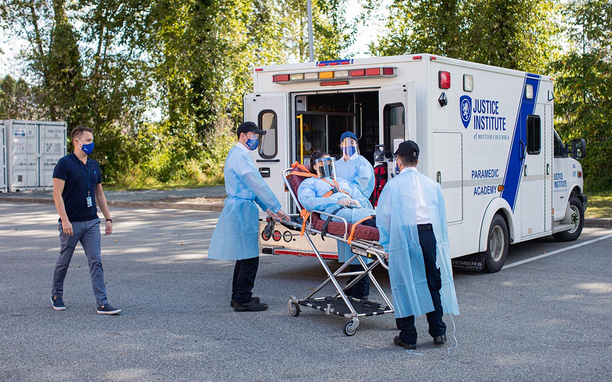 JIBC's Primary Care Paramedic students wearing full personal protective equipment (PPE) when practising skills on each other during training simulations.