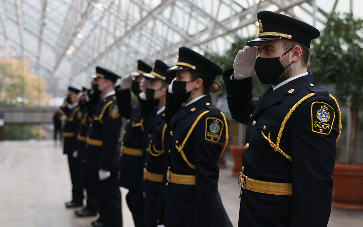 B.C. sheriff recruits salute during graduation from the JIBC Sheriff Academy in a ceremony held at the courthouse in Vancouver.