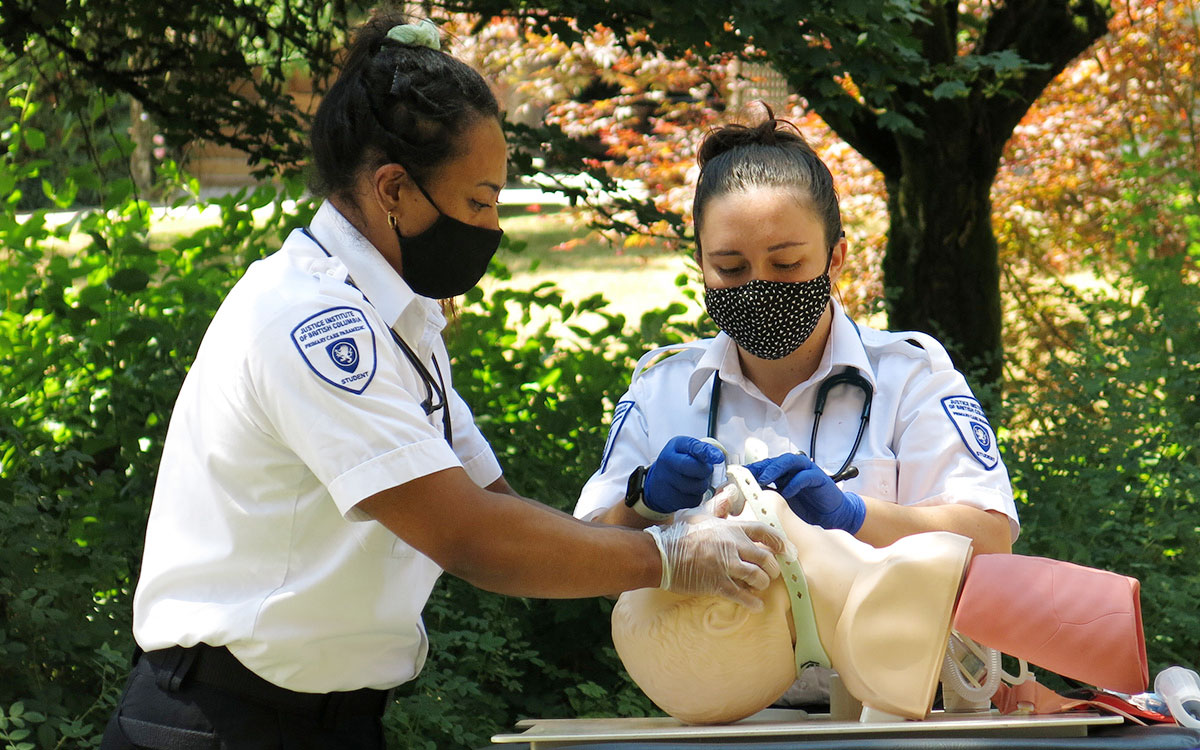 JIBC paramedic students demonstrate their use of a recently donated airway training manikin.