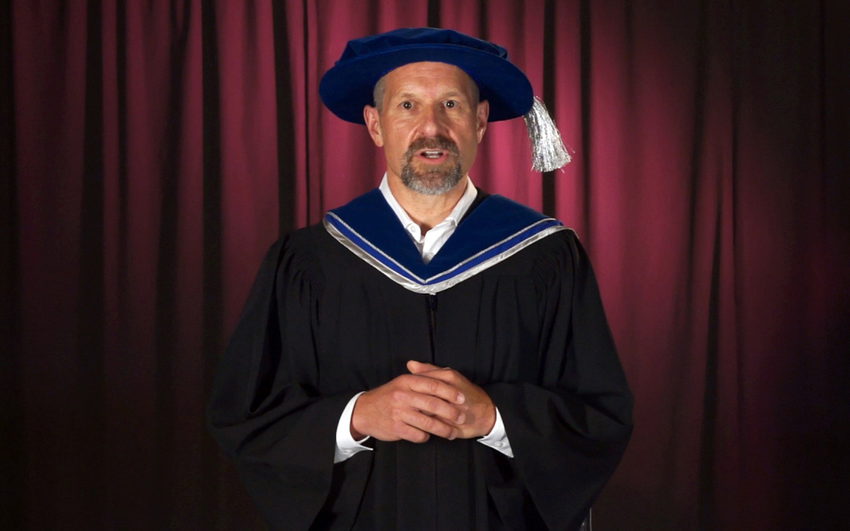 Retired Abbotsford Police Department officer Michael Novakowski speaks following the conferring of his honorary degree.