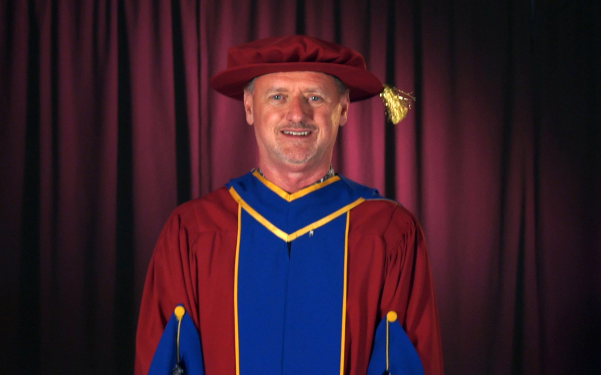 JIBC President and CEO Dr. Michel Tarko addresses graduates at the 2021 Spring Convocation ceremony held virtually.