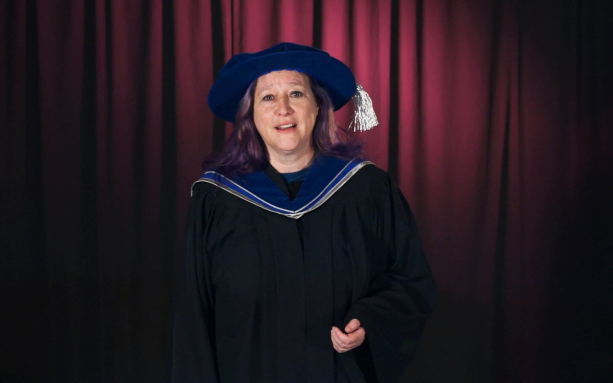 Lawyer and mediator Sharon Sutherland addresses the graduating class following the conferring of her honorary degree.