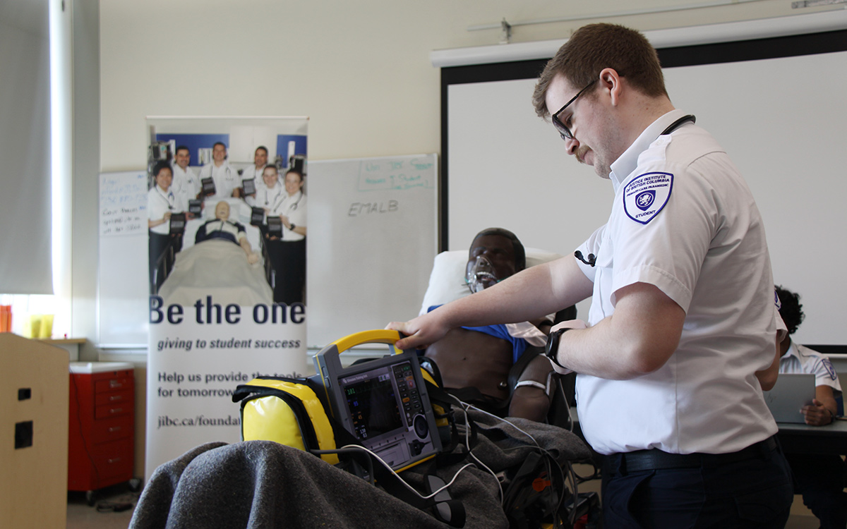 A JIBC paramedic student demonstrates use of an iSimulate monitor funded through the generosity of an anonymous donor.