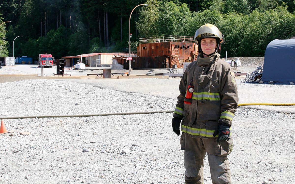 Mackenzie Millward in firefighter turnout gear at JIBC's Maple Ridge campus.