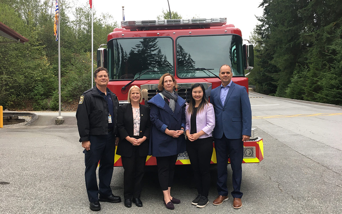 From left, Fire & Safety Division's Dave Wallack, Maple Ridge-Pitt Meadows MLA Lisa Beare, Dean of the School of Public Safety Sarah Wareing, Minister Anne Kang and Acting President Mike Proud with new fire engine at JIBC's Maple Ridge campus.