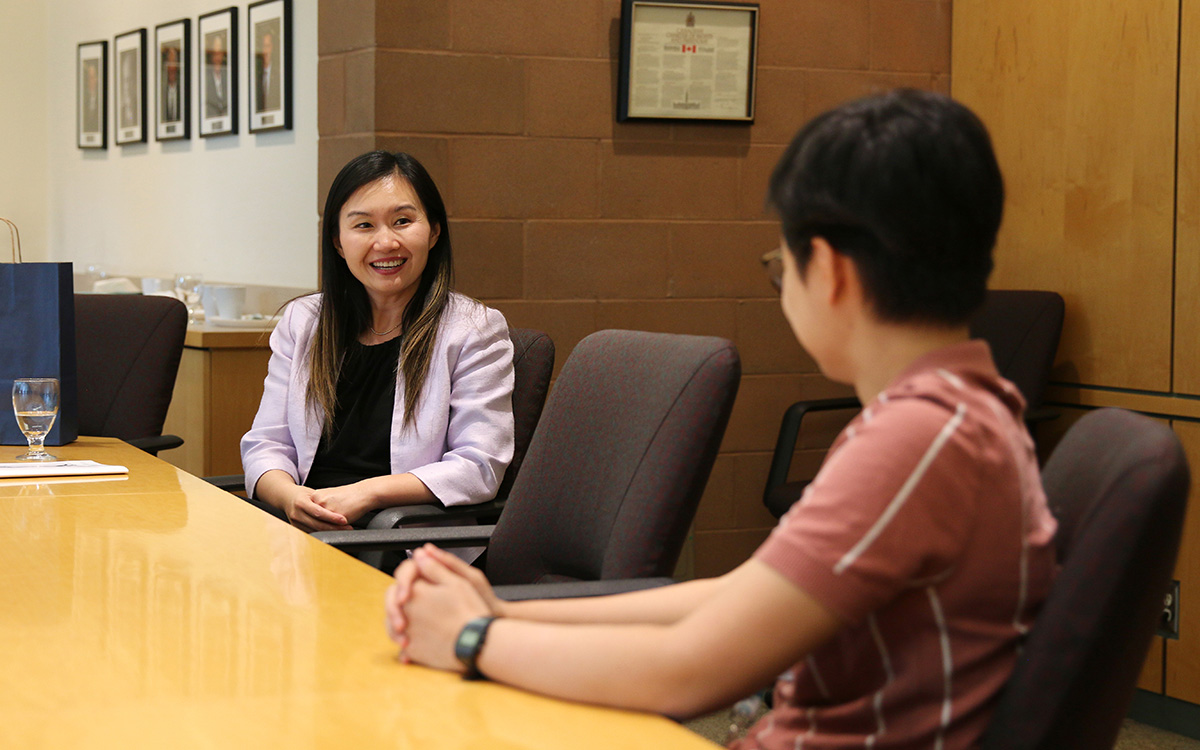 Minister Anne Kang meets with Alex Nguyen of the JIBC Students Union at the New Westminster campus.