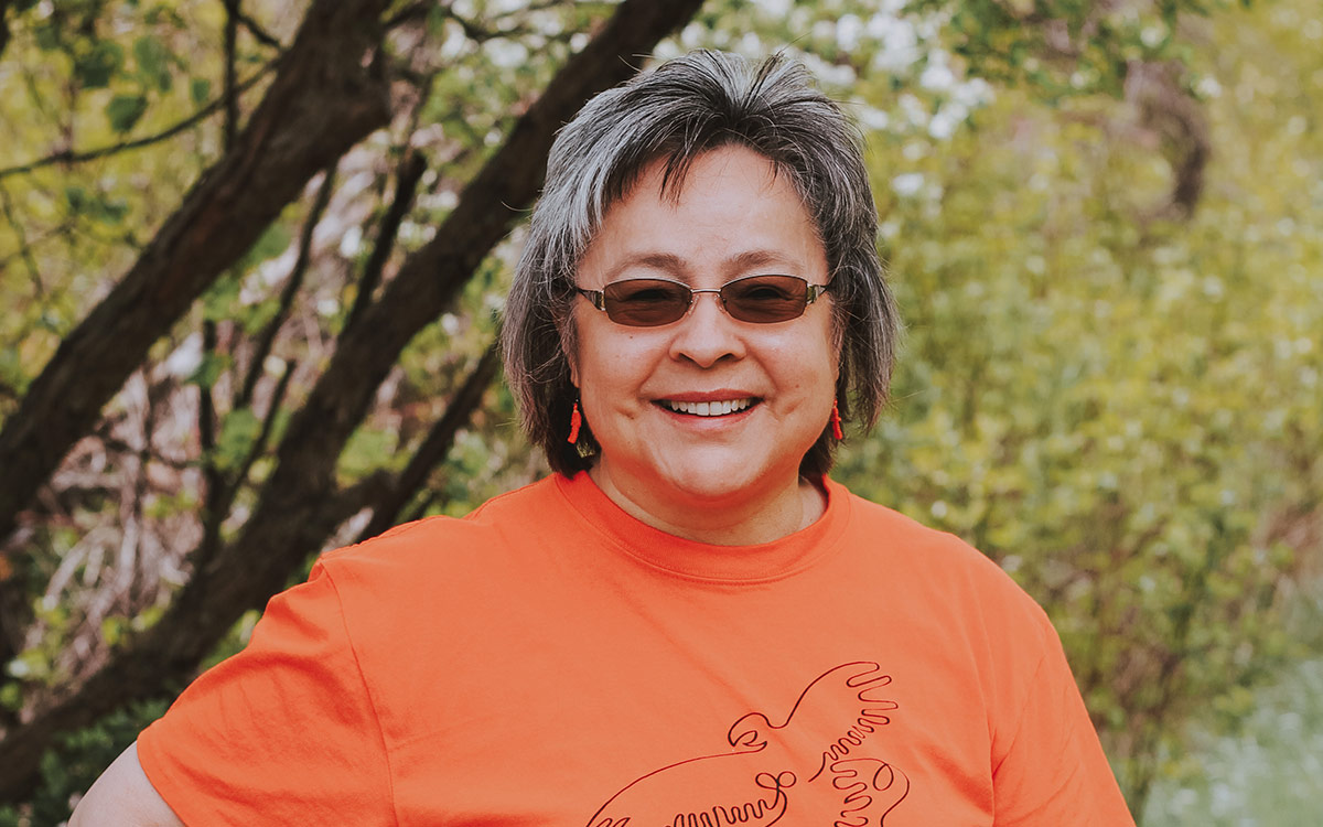 Phyllis Webstad wearing orange shirt.