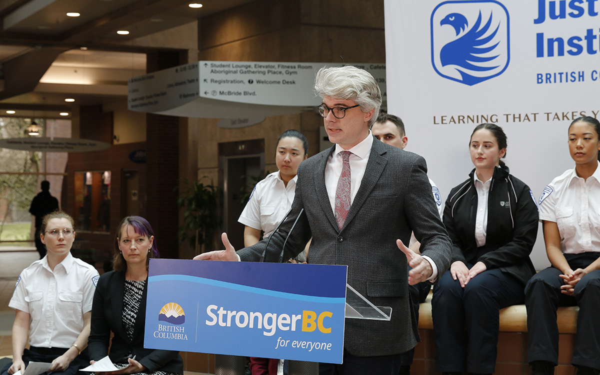 Andrew Mercier, Minister of State for Workforce Development, speaks at podium at JIBC.