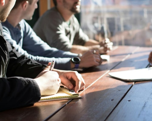 people writing on the table