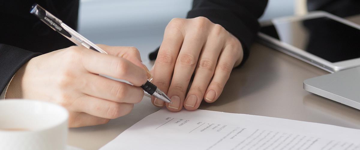 JIBC people signing documents