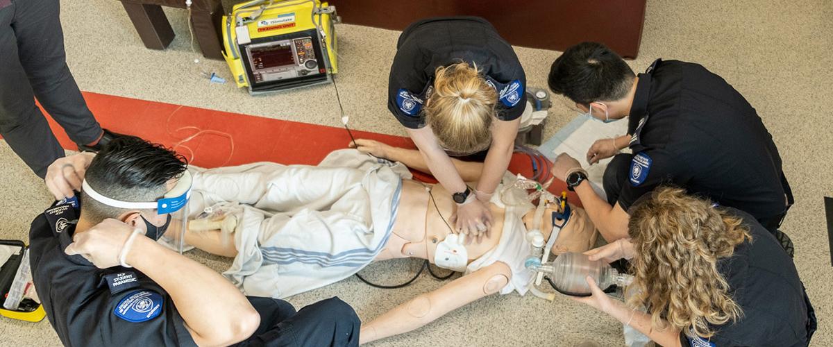 Advanced Care Paramedic students practise their training on mannequin.