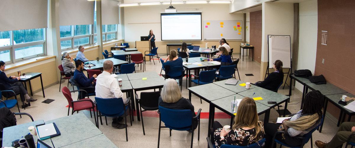 Wide view of students in a classroom.