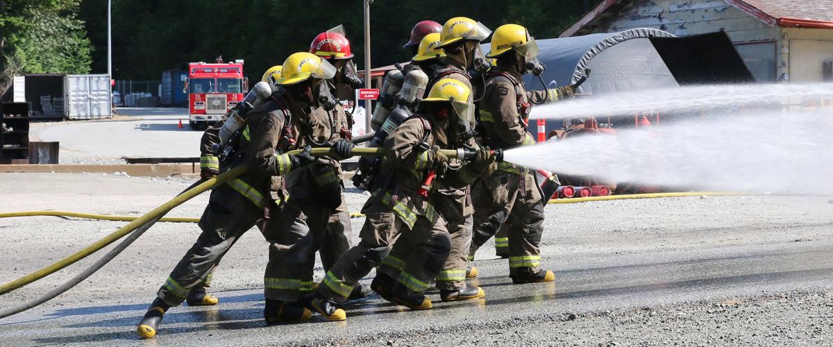 JIBC firefighting students perform live-fire training exercise.