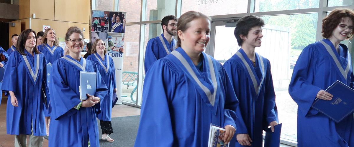 Graduates exit 2022 Spring Convocation ceremony.