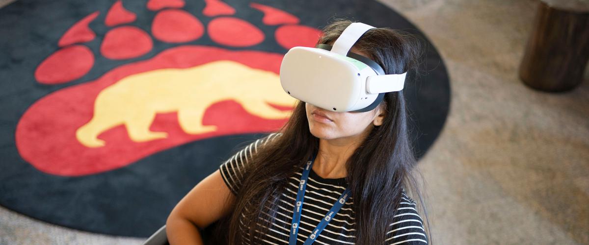 Woman wearing virtual reality headset.