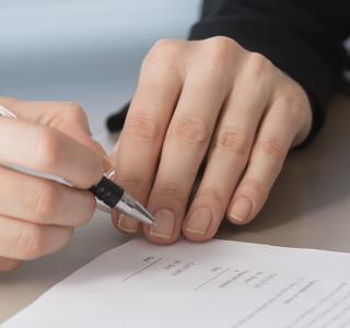 JIBC people signing documents