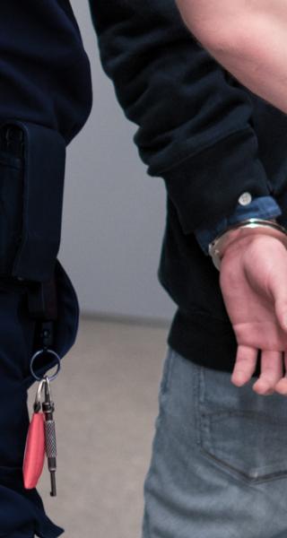 Security officer with someone on handcuffs