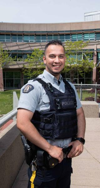 Two years after graduating from JIBC, Mansoor Sahak was hired as an RCMP officer, a role he hopes will help him to give back to Canada for taking in his family as refugees.