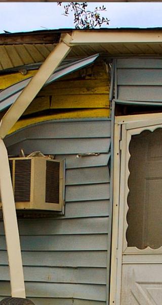 A house damaged by a natural disaster.