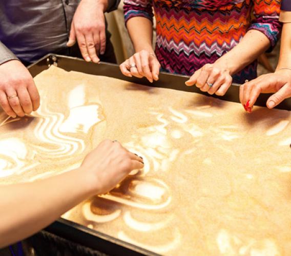 Expressive Play Therapy playing with sand