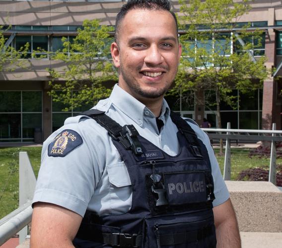JIBC graduate Mansoor Sahak was hired as an RCMP officer, a role he hopes will help him to give back to Canada for taking in his family as refugees.