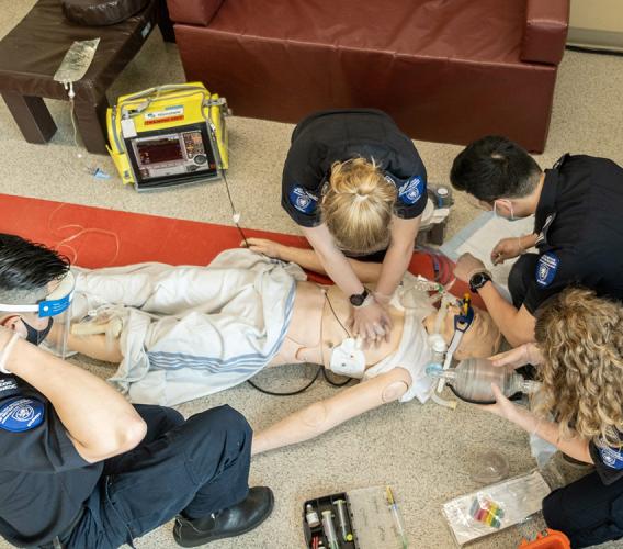 Advanced Care Paramedic students practise their training on mannequin.