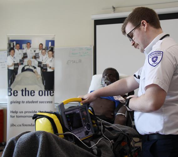 A JIBC paramedic student demonstrates use of an iSimulate monitor funded through the generosity of an anonymous donor.