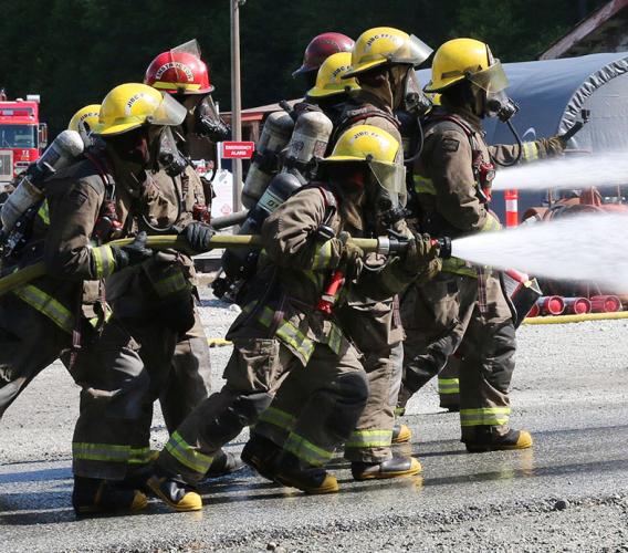 JIBC firefighting students perform live-fire training exercise.