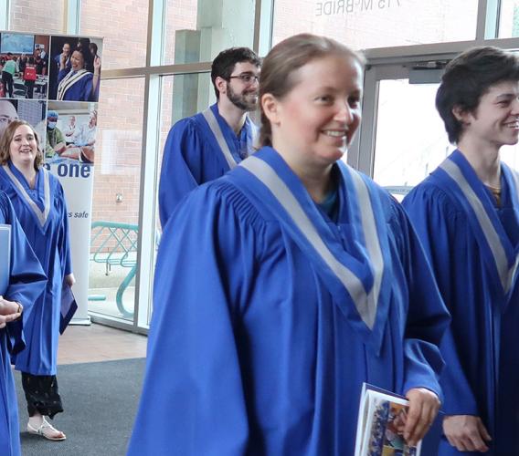 Graduates exit 2022 Spring Convocation ceremony.