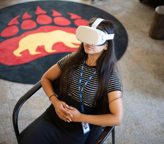 Woman wearing virtual reality headset.