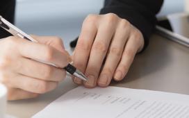 JIBC people signing documents