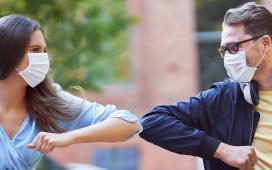 Students greeting each other with elbows