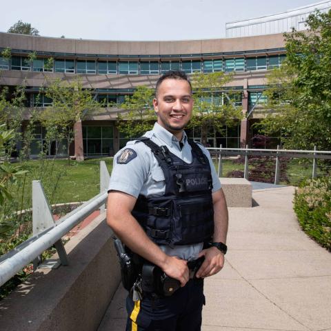 Two years after graduating from JIBC, Mansoor Sahak was hired as an RCMP officer, a role he hopes will help him to give back to Canada for taking in his family as refugees.