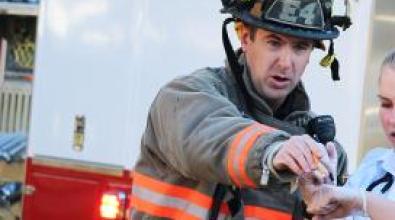 A firefighter in action at an emergency