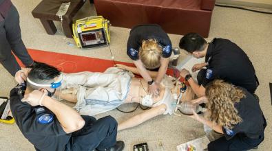 Advanced Care Paramedic students practise their training on mannequin.