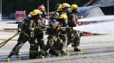 JIBC firefighting students perform live-fire training exercise.