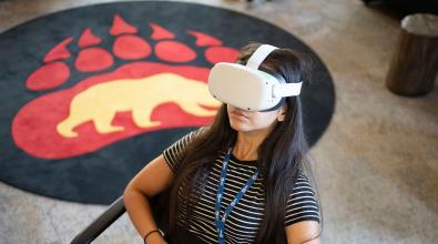 Woman wearing virtual reality headset.