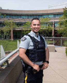 Two years after graduating from JIBC, Mansoor Sahak was hired as an RCMP officer, a role he hopes will help him to give back to Canada for taking in his family as refugees.