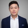 Man wearing dark blazer and white shirt.