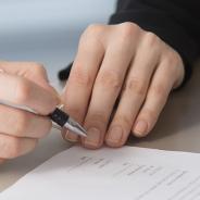 JIBC people signing documents