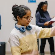 student looking at books